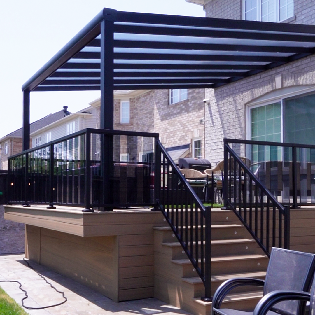 EG Aluminum black louvered pergola on a raised deck in Milton, Ontario